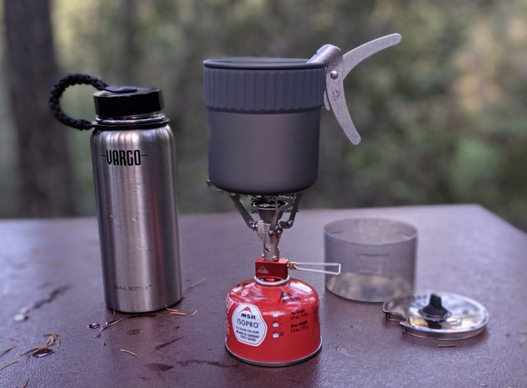 MSR PocketRocket 2 Mini Stove Kit next to a 1 liter water bottle.