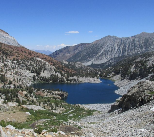 Blue lake surrounded by high granite peaks