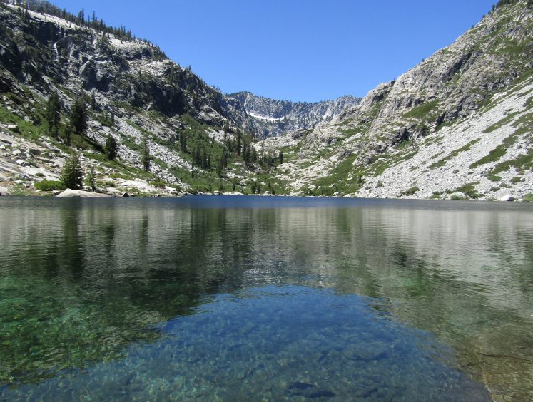 Alpine lake surrounded by granite peaks
