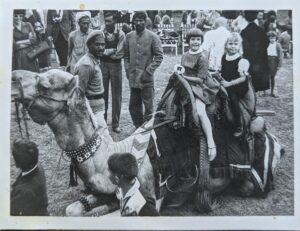 Two young girls on a camel