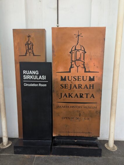 Large metal sign with the name of Museum Sejarah Jakarta. 
