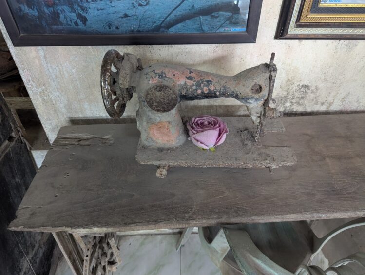 A burned, ash covered sewing machine from a Mt. Merapi eruption is on display at a museum.
