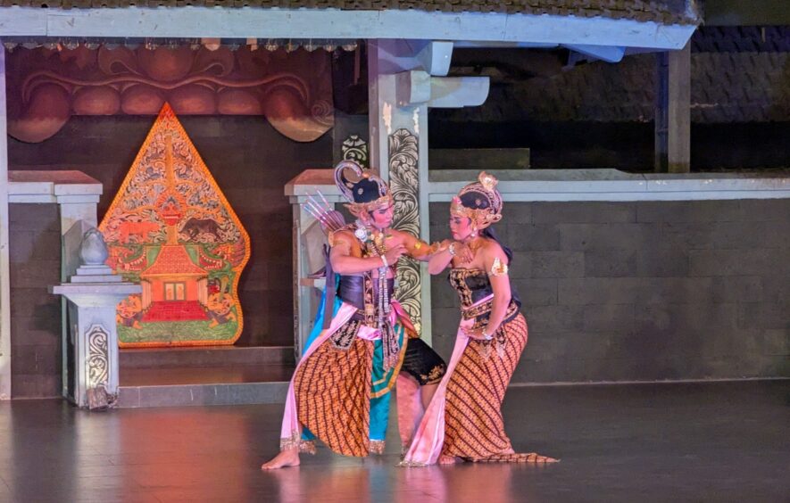 Two Indonesian dancers perform part of the stylized dance from the Ramayana