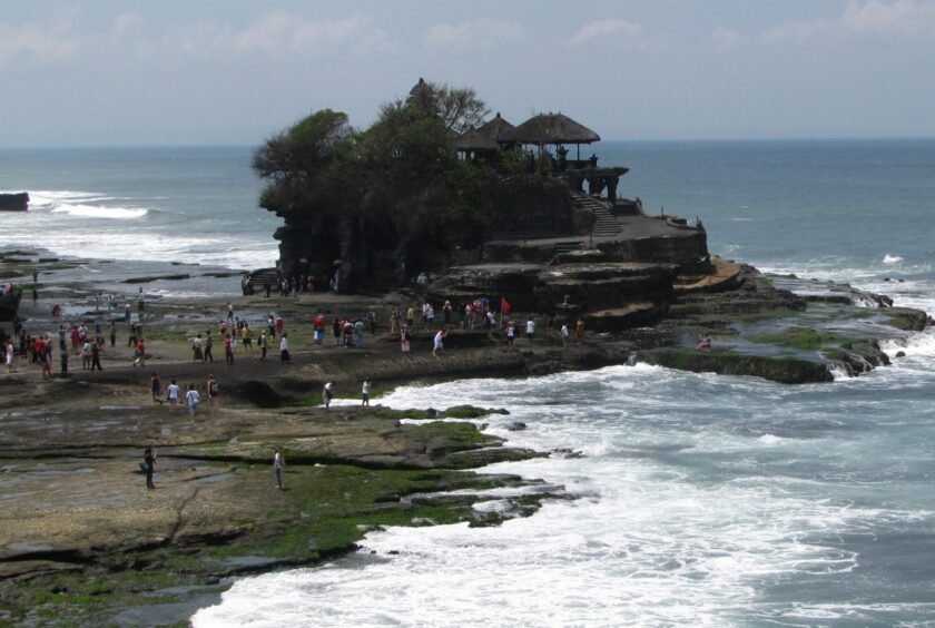 Tanah Lot Temple in the water at the shore