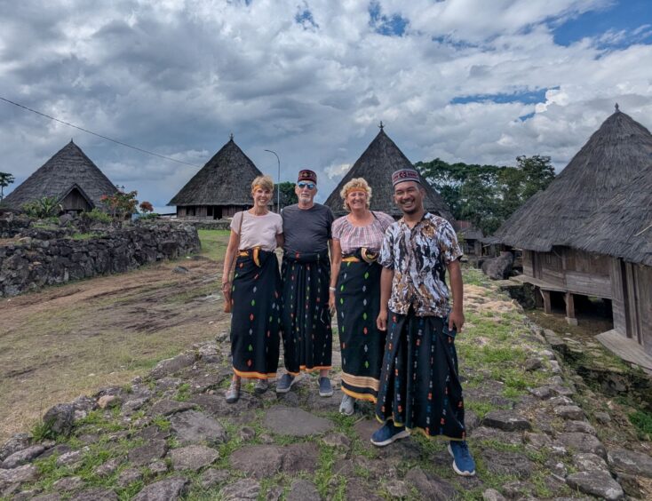 Two American women, the author's husband and guide, Filan, in local sarongs